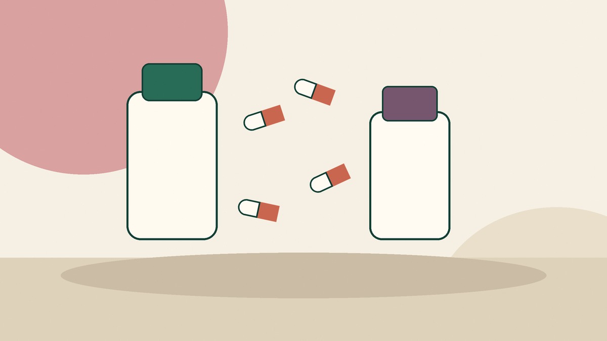 Unbranded medicine bottles and tablets arranged on a neutral surface