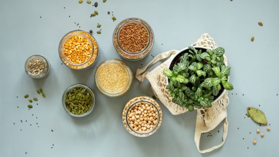 Millets, dals and seeds in glass jars